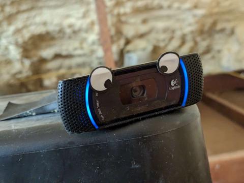 Old webcam with googly eyes